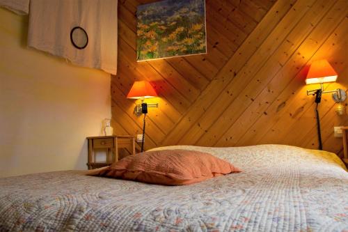 Postel nebo postele na pokoji v ubytování La Collegiale