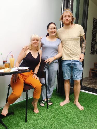 a group of three people posing for a picture at Sunny Riverside Homestay in Hoi An