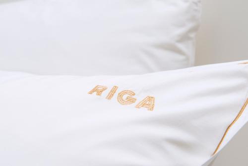 Una cama o camas en una habitación de Hotel Riga