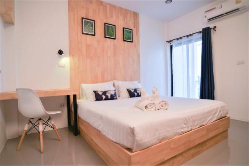 Postel nebo postele na pokoji v ubytování The Cozy Hotel
