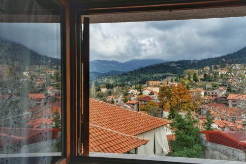 a view of a city from a window at To Balkoni tis Agorianis in Eptalofos