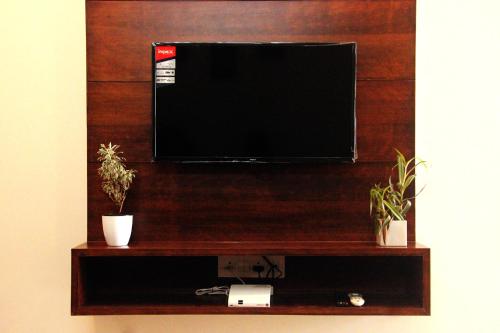 TV a/nebo společenská místnost v ubytování GTS SUITES