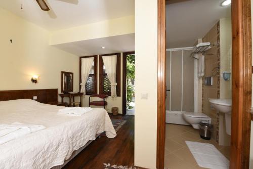 Ένα ή περισσότερα κρεβάτια σε δωμάτιο στο Villa Konak Hotel