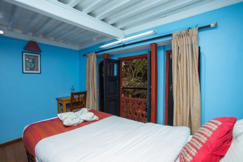 Postel nebo postele na pokoji v ubytování Kathmandu Boutique Hotel