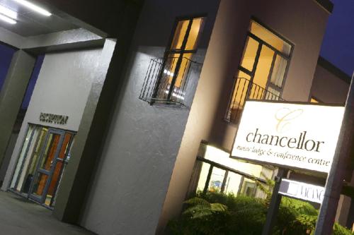 a building with a sign in front of it at Chancellor Motor Lodge and Conference Centre in Palmerston North