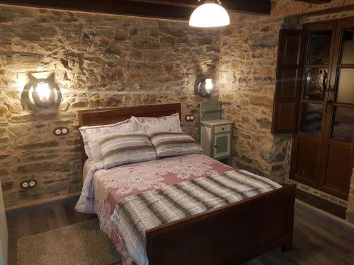 Postel nebo postele na pokoji v ubytování Apartamentos Rurales Casa Carmen