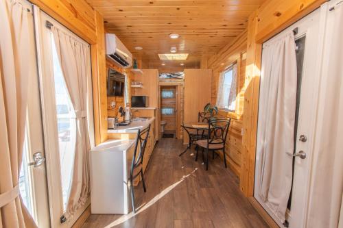 a kitchen and dining room in a tiny house at Tiny House Leadville Colorado in Leadville