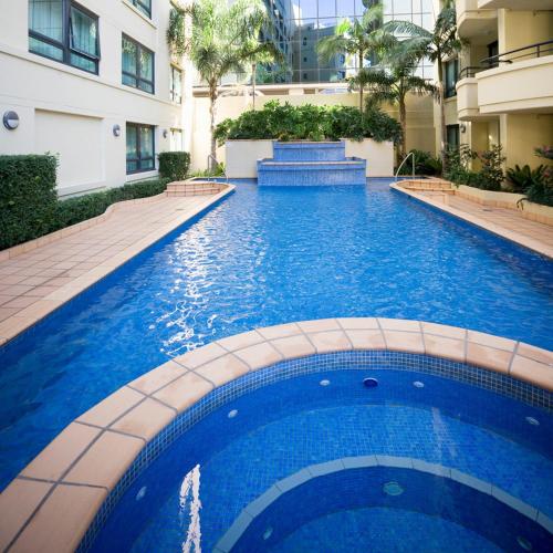 a swimming pool in the middle of a building at Mantra Parramatta in Sydney