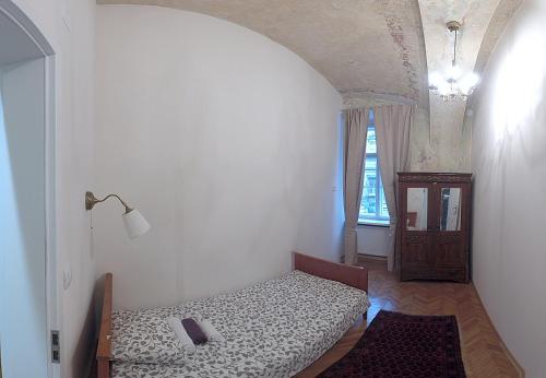 a bedroom with a bed in a room with a window at Zagreb Speeka in Zagreb