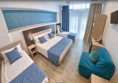 Postel nebo postele na pokoji v ubytování Hotel Luxor Florence