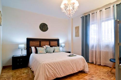 Postel nebo postele na pokoji v ubytování SWEET HOME ÁVILA