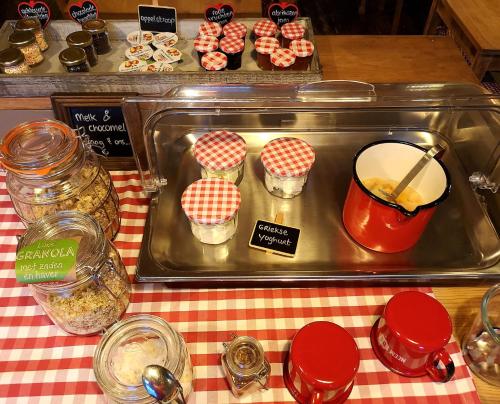 a table with a tray of food on top of a table at Villa Warempel in Valkenburg