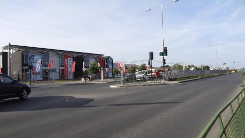 a car driving down a street with a traffic light at Tralka B&B in Talca