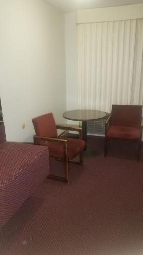a room with a table and two chairs and a table at Amber Inn Motel in Bliss