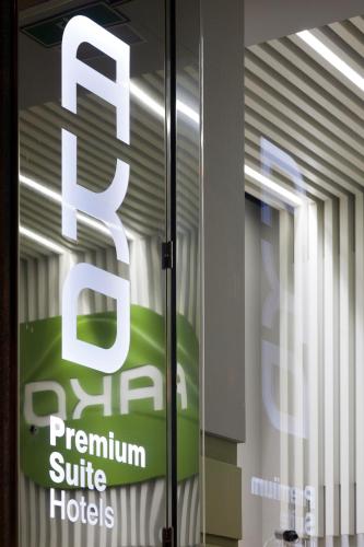 a sign on a glass door in a building at Ako Suite Hotel in Barcelona