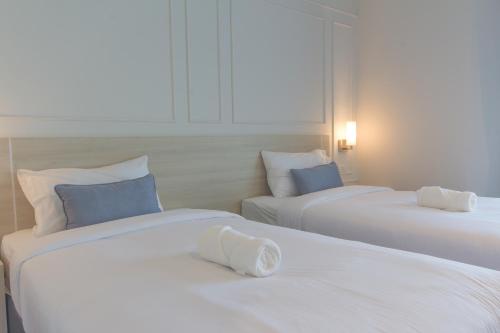 Ένα ή περισσότερα κρεβάτια σε δωμάτιο στο Donchan Grand Hotel