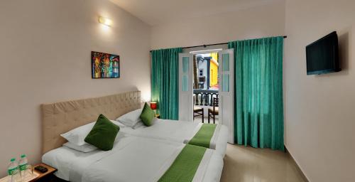 Katil atau katil-katil dalam bilik di Santiago Beach Resort