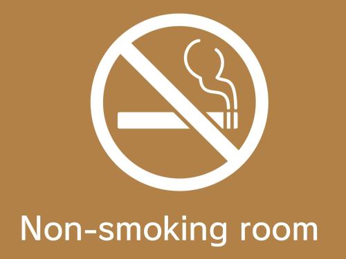 a sign for no smoking room with a burning coil in it at Grand Hotel Staymore -Adult Only in Natori