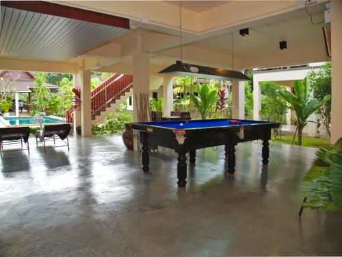 a pool table in the middle of a patio at Chanapha Residence in Tab Kaek Beach