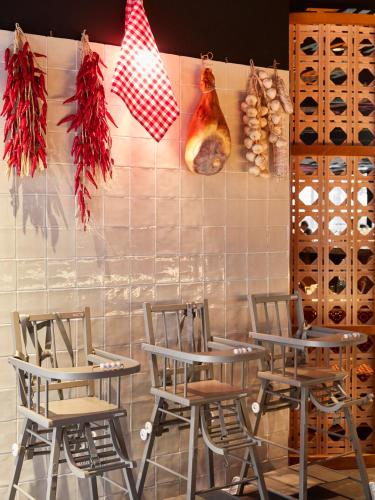 a group of tables and chairs in a restaurant at Mama Shelter Toulouse in Toulouse