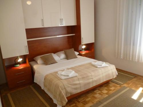 En eller flere senger på et rom på Apartments Slavica