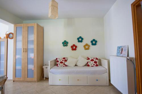 a bedroom with a bed with pillows on it at Bozis Private Pool Villa, Siviri in Siviri