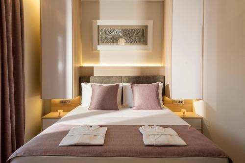 Ένα ή περισσότερα κρεβάτια σε δωμάτιο στο Amaen Luxury House