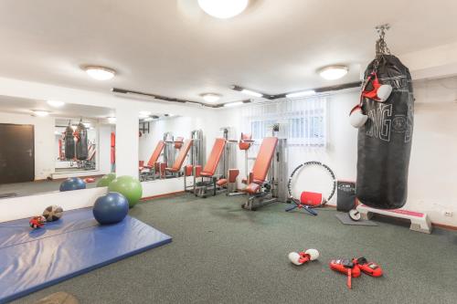 a gym with a punching bag on the wall and equipment at Willa Bryza in Gdynia