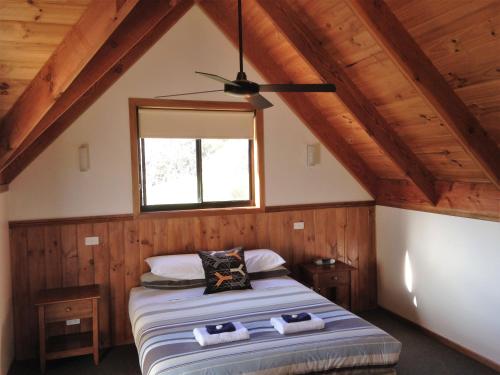 A bed or beds in a room at Prom Coast Holiday Lodge