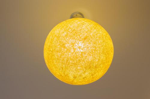 a close up of an orange hanging from a ceiling at Gengmengyuan B&B in Xikou
