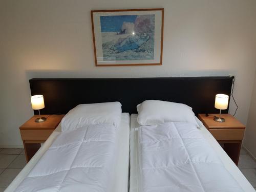 En eller flere senge i et værelse på Vakantiepark Het Timmerholt 11