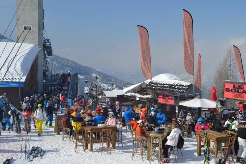 a crowd of people at a ski resort in the snow at Le Solan d'Aniathazze in Peisey-Nancroix
