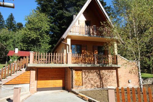 a house with a staircase and a balcony at House Marko Breze in Ledenice