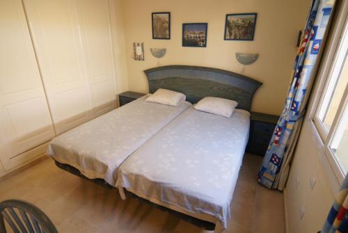 Llit o llits en una habitació de Homely Apartment (PA4-16)