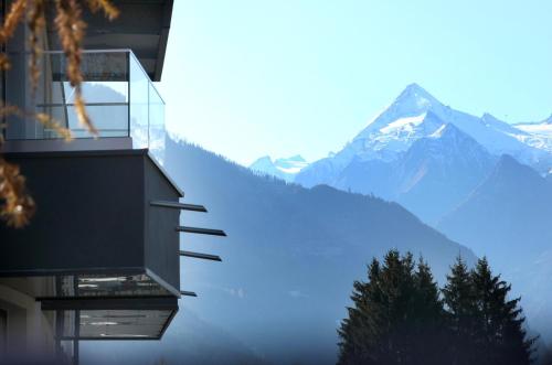 a house with a view of a mountain at Aparthotel Zell am See (Contactless Check-In) in Zell am See
