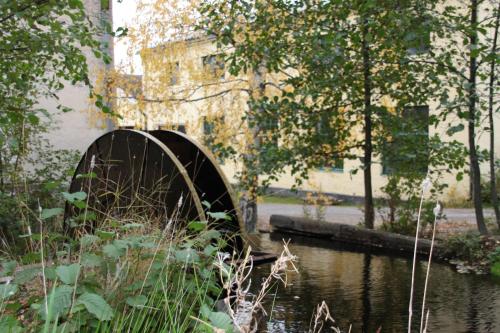 a bridge over a body of water in a park at Hotel Mathildedal in Mathildedal