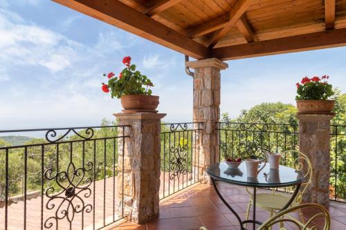 a balcony with a table and a view at Hotel Relais Pian delle Starze in Marina di Camerota