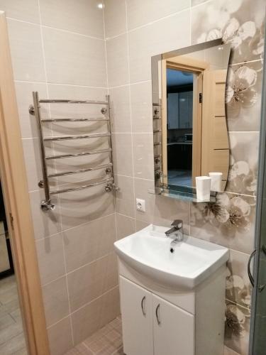 a bathroom with a sink and a mirror at вулиця Дрогобицька 10в in Truskavets