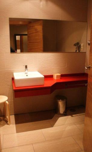 a bathroom with a sink and a mirror at Hotel Rural Las Rozuelas in Cercedilla