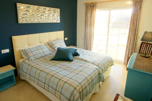 a bedroom with a bed with a pillow on it at Attractive Apartment (PA 4-17) in Estepona