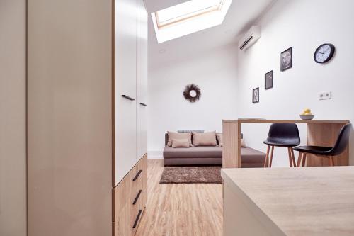 a living room with a couch and a table at Nordian in Kharkiv