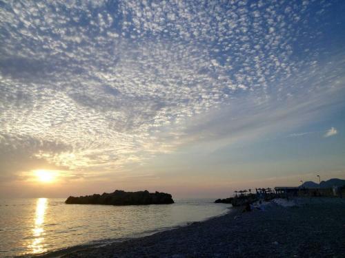 a view of a beach with a cloudy sky at Apart Hotel XXL Lux in Dobra Voda