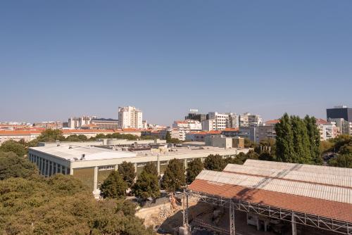 an overhead view of a city with buildings and trees at Hotel Canada in Lisbon