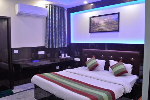 מיטה או מיטות בחדר ב-Cottage Ganga Inn