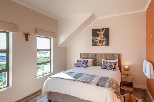 Ένα ή περισσότερα κρεβάτια σε δωμάτιο στο Wind-Rose Guest House