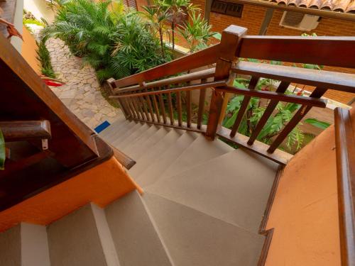 an overhead view of a staircase with a wooden railing at Pousada Pé Na Areia in Caraguatatuba