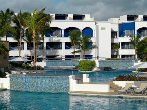 a view of the resort from the pool at Hard Rock Hotel Riviera Maya - Heaven Adults Only - All Inclusive in Puerto Aventuras
