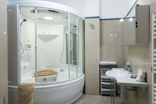 a bathroom with a shower and a sink at KiBari B&B in Bari
