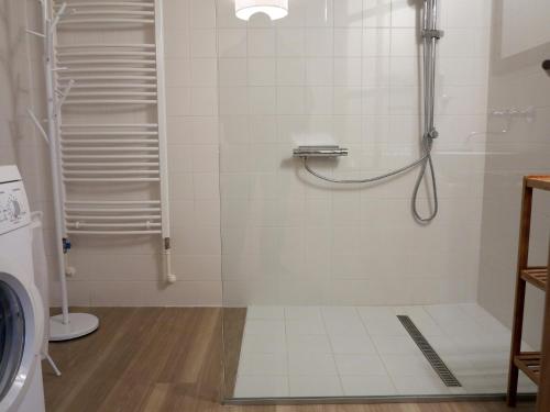 a shower stall in a bathroom with a toilet at Vila Verunka in Plzeň