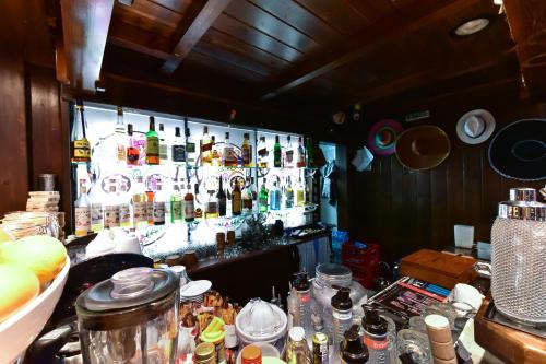 a bar with a lot of bottles of alcohol at Hotel Ida in Bansko